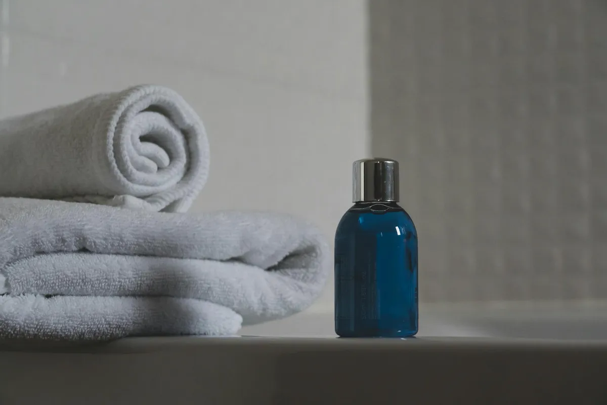 Hair care products on a bathroom shelf